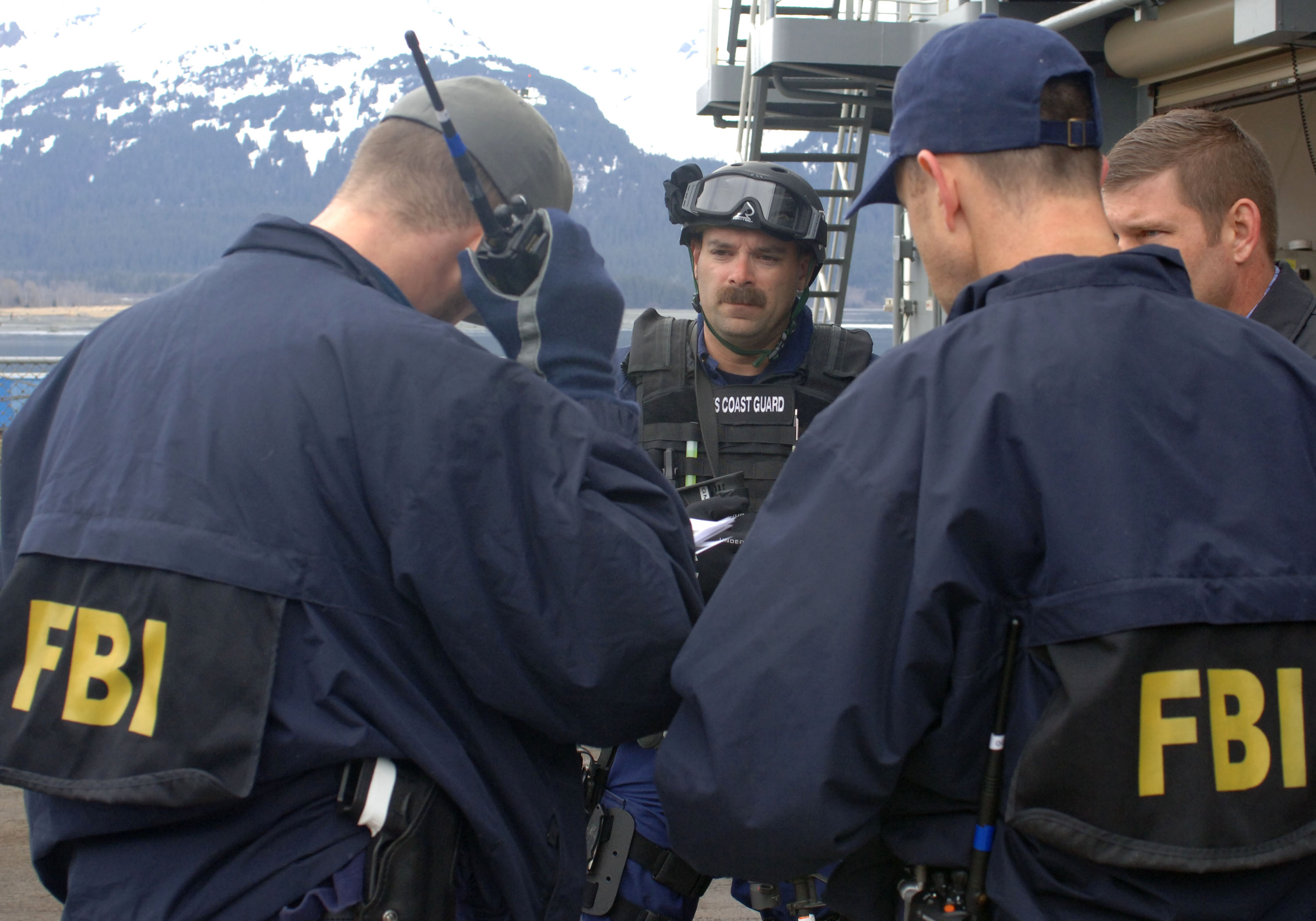 070511-N-7949W-034
SEWARD, Alaska (May 11, 2007) Ð A member of U.S. Coast Guard Maritime Safety & Security Team, Anchorage (MSST 91111) speaks with a FBI special agent after completing a search of USNS Henry J. Kaiser (T-AO 187) as part of Alaska Shield/Northern Edge 07 (AKS/NE 07). AKS/NE 07 is a State of Alaska/US NORTHCOM sponsored homeland defense/defense support of civil authorities exercise; part of the national-level Ardent Sentry/Northern Edge 07.  ItÕs an opportunity to practice responding to homeland defense/disaster events with the federal, state, local & private-sector team. U.S. Navy photo by Mass Communication Specialist 1st Class Daniel N. Woods